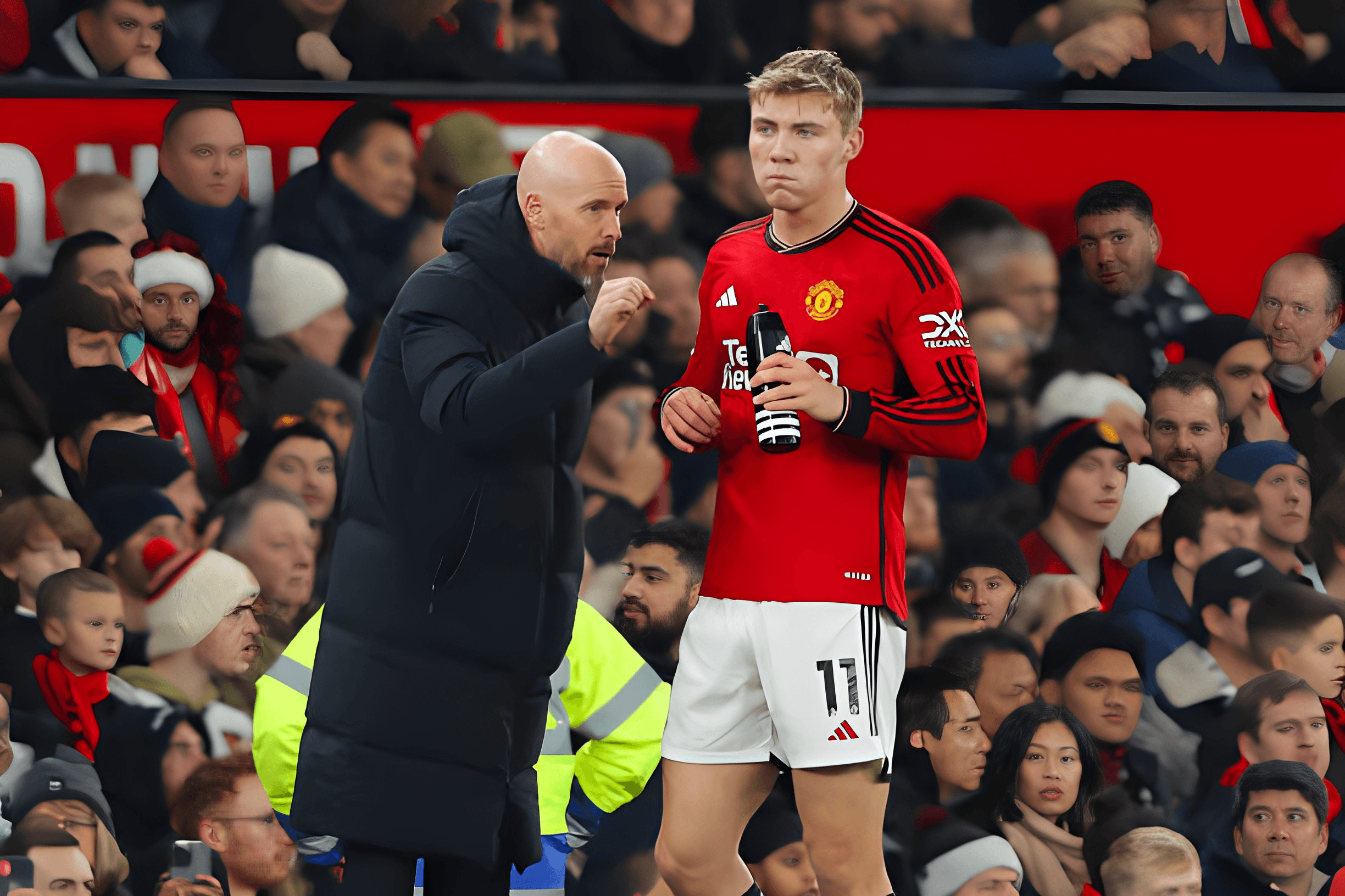 Erik ten Hag, Manchester United manager, talks to Rasmus Hojlund during a Premier League match at Old Trafford on December 26, 2023.