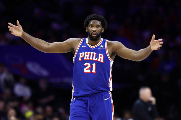 Joel Embiid #21 of the Philadelphia 76ers reacts during the third quarter against the Denver Nuggets at the Wells Fargo Center on January 16, 2024 in Philadelphia, Pennsylvania.
