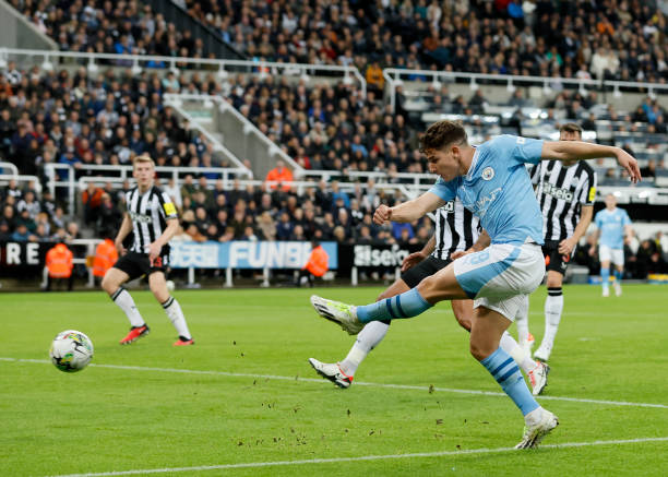 Julian Alvarez of Manchester City shoots during Carabao Cup match between Newcastle and Manchester City in Newcastle, England.