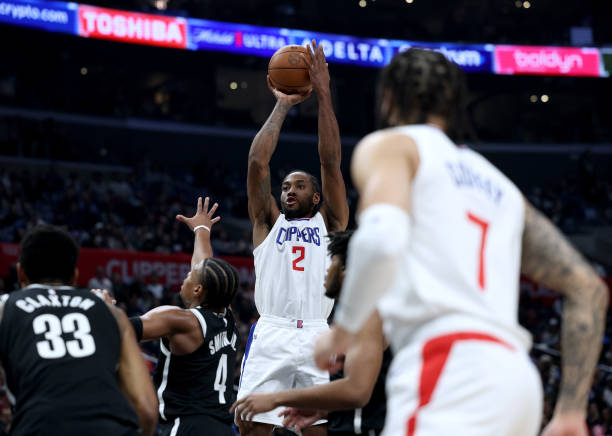 Kawhi Leonard shooting over Dennis Smith Jr. in a Clippers win at Crypto.com Arena on January 21, 2024.