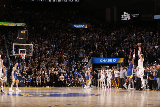 Nikola Jokic #15 of the Nuggets shoots a game-winning 3-pointer against the Warriors at Chase Center in San Francisco, CA.