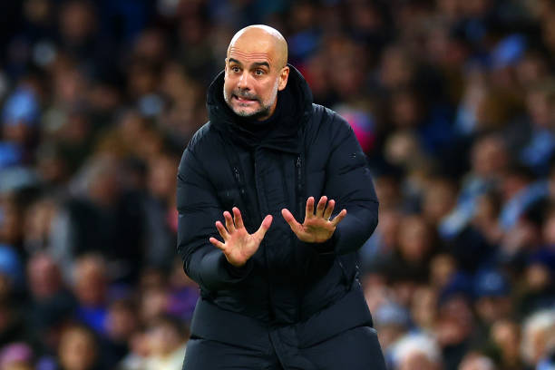 Guardiola gestures from the touchline during a Premier League match between Manchester City and Sheffield United at Etihad Stadium.