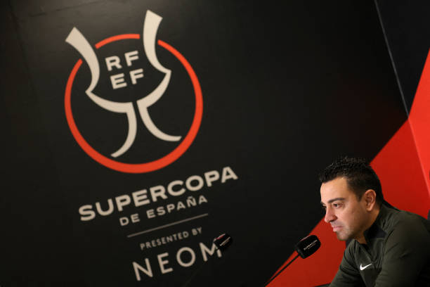 Xavi speaks during a press conference before the Spanish Super Cup final match between Real Madrid and Barcelona.