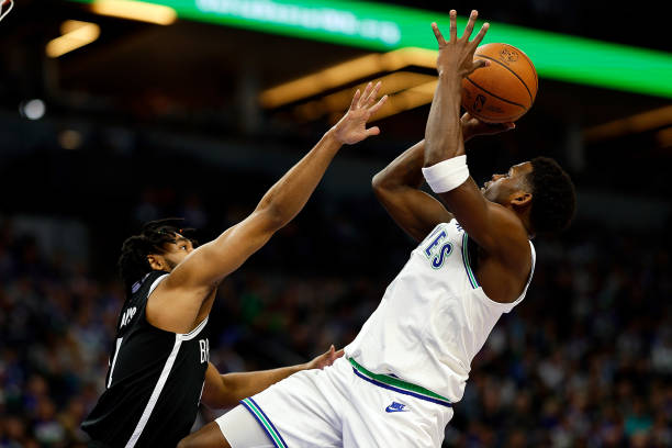 Anthony Edwards of the Timberwolves shoots the ball against Cam Thomas of the Nets during the first quarter at Target Center.