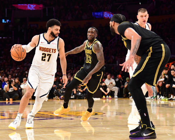 Jamal Murray of the Nuggets dribbles the ball during the game against the Lakers on February 8, 2024 at Crypto.Com Arena in Los Angeles, California.