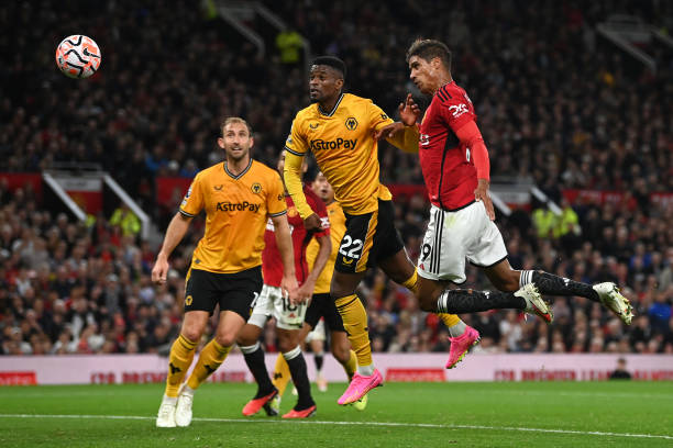 Raphael Varane scores for Manchester United in Premier League match against Wolves at Old Trafford.