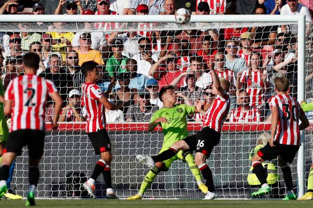 Ben Mee scores their third goal during the Brentford vs Manchester United Premier League match at Gtech Community Stadium on August 13, 2022. The Bees won 4-0.