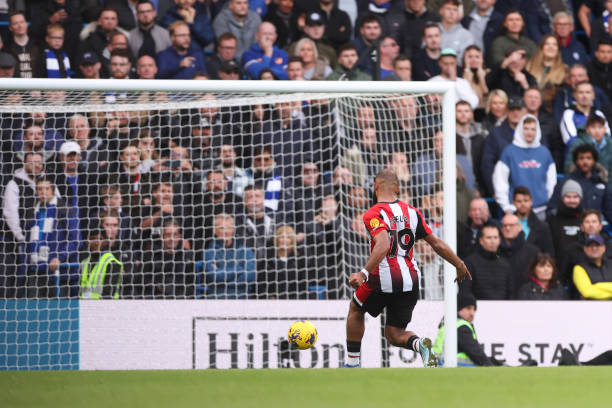 Bryan Mbeumo scores during the Brentford vs Chelsea Premier League match at Stamford Bridge.
