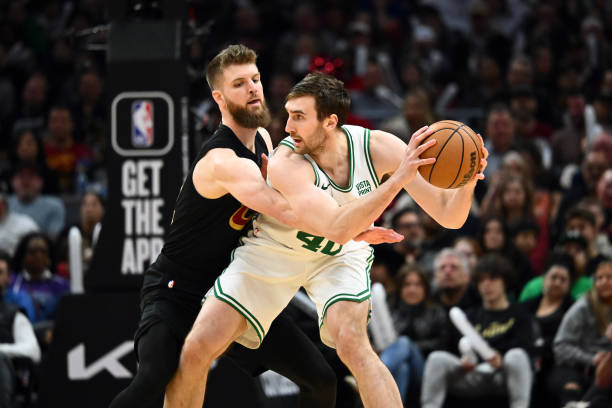Dean Wade of the Cavaliers guards Luke Kornet of the Boston Celtics during the fourth quarter at Rocket Mortgage Fieldhouse.