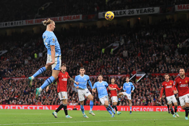 Erling Haaland scores during the Manchester City vs Manchester United Premier League match at Old Trafford on October 29, 2023.