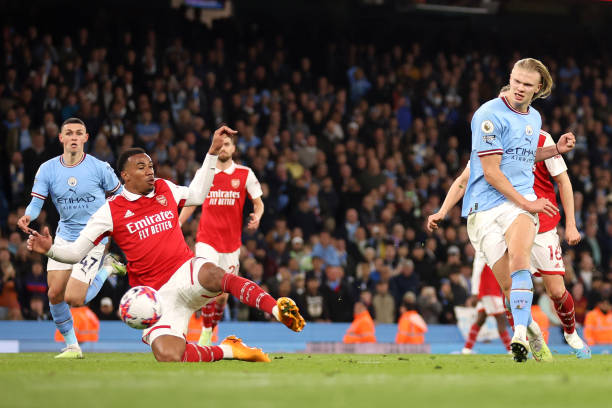 Erling Haaland scores during the Manchester City vs Arsenal Premier League match at Etihad Stadium on April 26, 2023. City won 4-1.