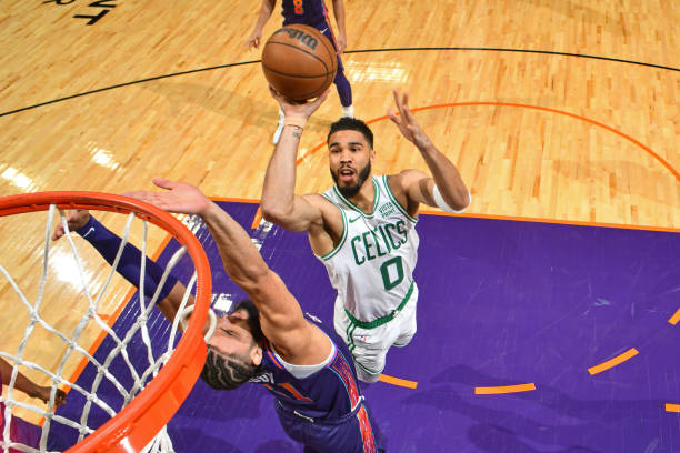 Jayson Tatum of the Boston Celtics drives to the basket during the game against the Suns at the Footprint Center.