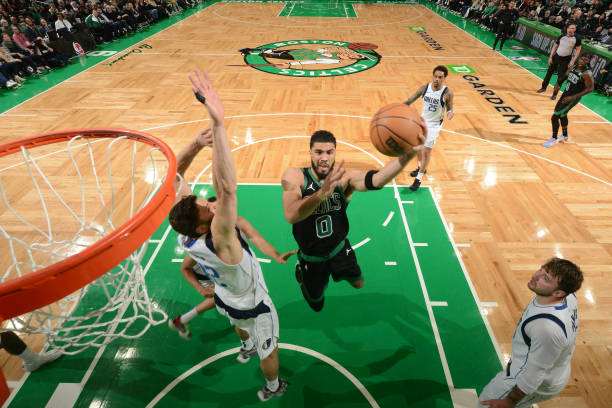 Jayson Tatum of the Boston Celtics drives to the basket during the game against the Mavericks at the TD Garden in Boston.