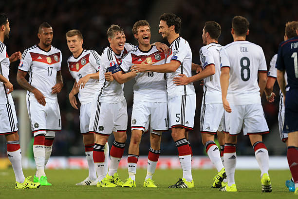 Thomas Muller celebrates with his teammates after scoring during the Germany vs Scotland UEFA EURO 2016 Qualifying Group D match at Hampden Park on September 7, 2015.
